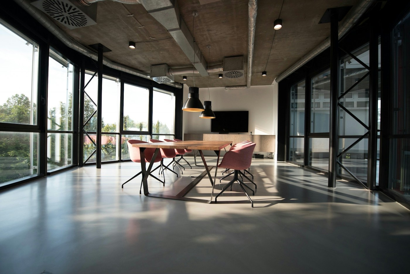 Contemporary creative workspace with shared tables and natural light
