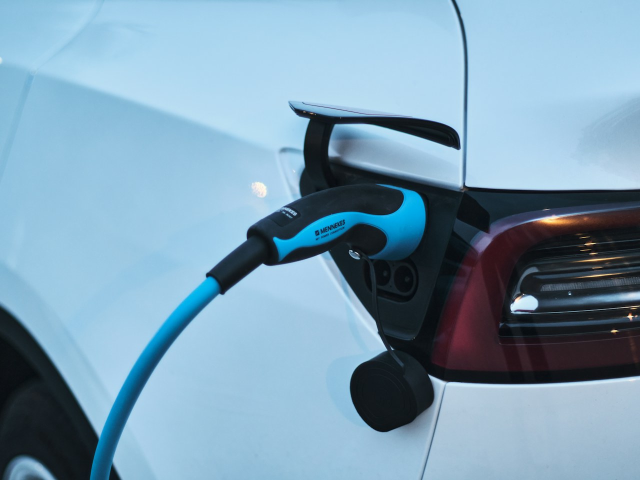 Electric vehicle connected to a charging point