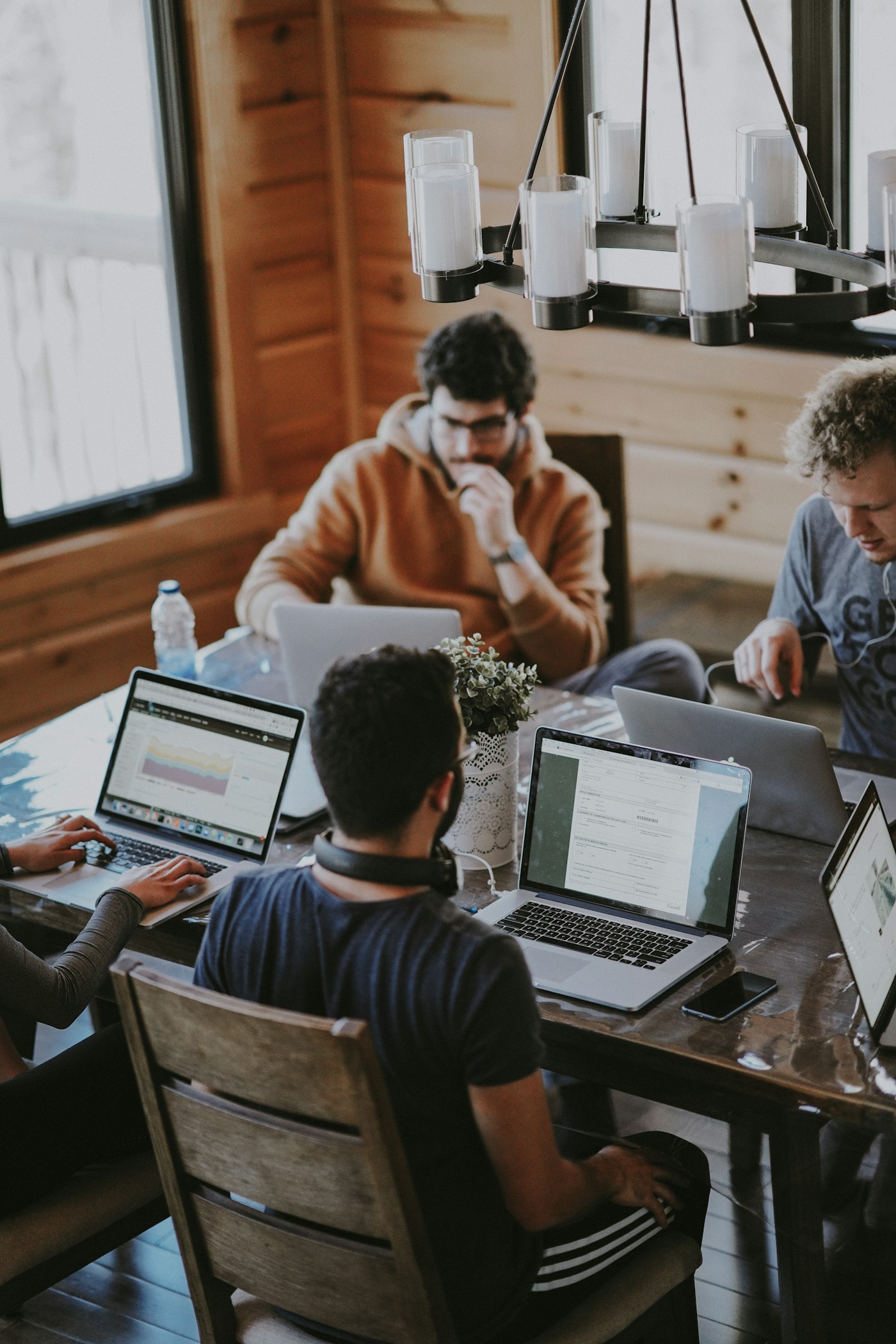 Technical professionals reviewing work together around a table